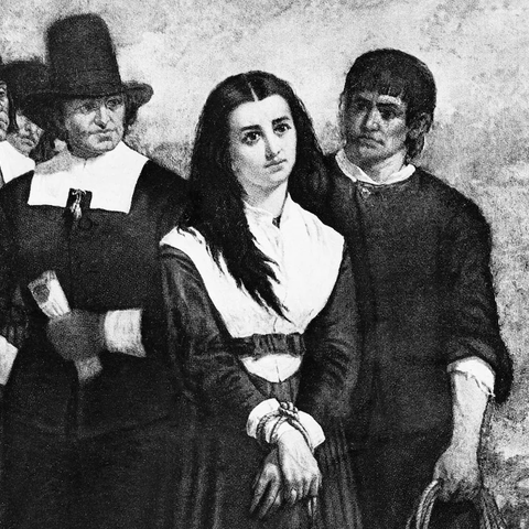 woman accused of being a witch surrounded by 4 men