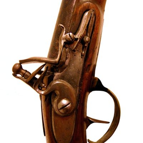 Detail of the flintlock of an 18th-century hunting rifle Detail of the flintlock of an 18th-century hunting rifle